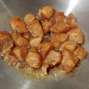 Browning off marinated chicken in a wok